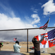 Supporters display a joint Canadian-American on an overpass as the ‘People’s Convoy’ passes on the way to Washington, DC to protest COVID-19 mandates on February 23, 2022 near Barstow, California.